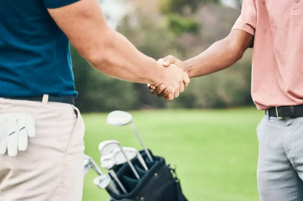 People, handshake and golf sport for partnership, trust or unity in community, collaboration or tea